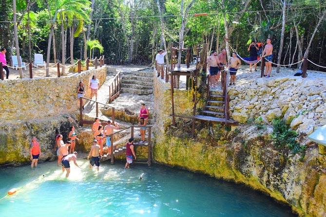 Activities Atv (single) Zipline and Cenote From Playa del Carmen - Riding a single ATV through muddy trails