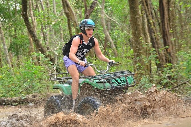 Exciting Day in Tulum Jungle: ATVs, Cenote, Zip lines, Rappel - Ziplines through the trees, including a water line