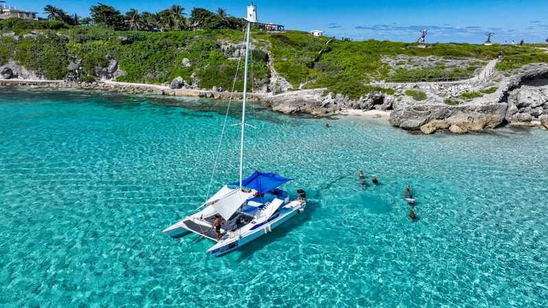 Isla Mujeres: Full Day Private Catamaran with Snorkeling - Open bar, music, and the social side of the day