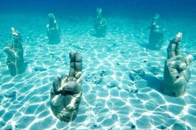 Isla Mujeres on luxury catamaran with snorkel, open bar and lunch - Premium drinks, music, and the return sail