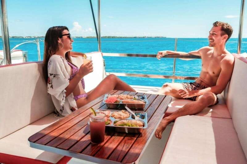 Isla Mujeres Plus Experience Catamaran Tour + Snorkel+Lunch - Isla Mujeres: beach time with a busy edge