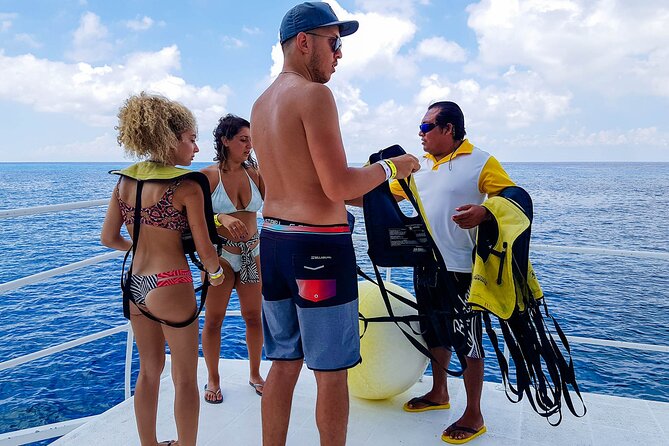 Tour to Cozumel by Catamaran with Snorkeling and Buffet Lunch - Boarding the catamaran at 11 am