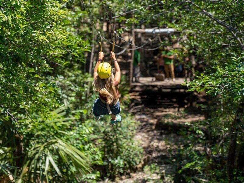 Tulum: Full Day Coba Ruins and Jungle ATV Tour - ATVs on a dusty jungle road